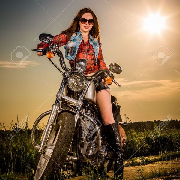 20151048 biker girl with sunglasses sitting on motorcycle stock photo woman