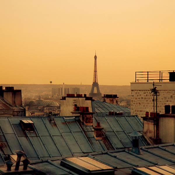 A view of the eiffel tower over paris rooftops