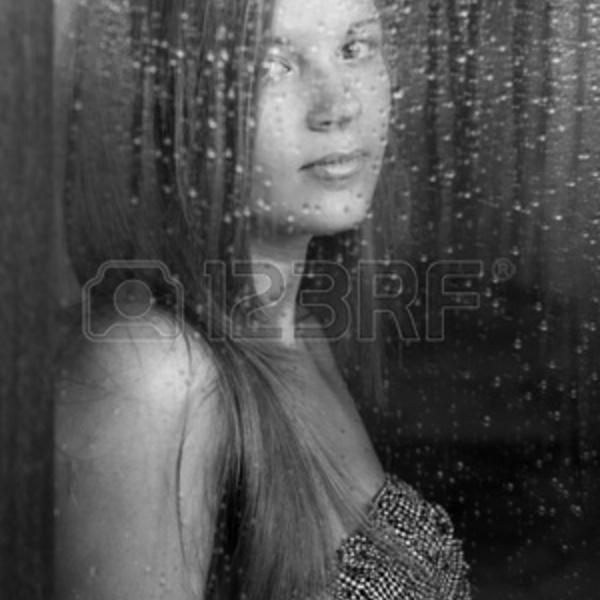 9731968 portrait of a beautiful girl and rainy window